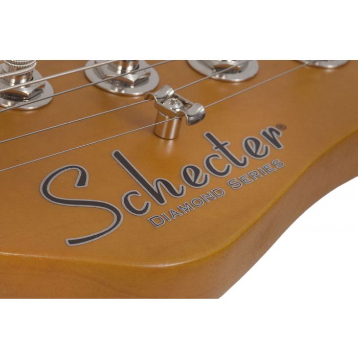 Closeup of the headstock logo on a Schecter PT Special Electric Guitar, Aqua Burst Pearl
