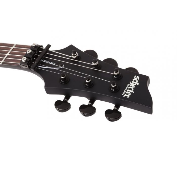 Front view of the headstock on a Schecter Damien-6 FR Electric Guitar, Satin Black