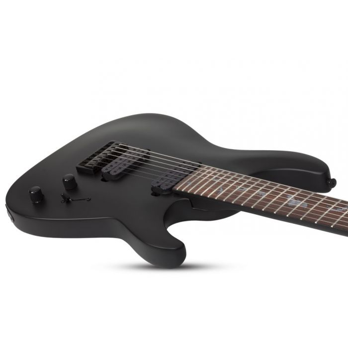 Angled view of the body on a Schecter Damien-7 7-String Electric Guitar, Satin Black