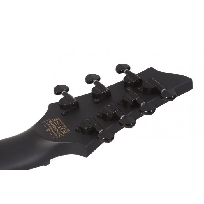 Rear view of the headstock on a Schecter Damien-7 LH 7-String Electric Guitar, Satin Black