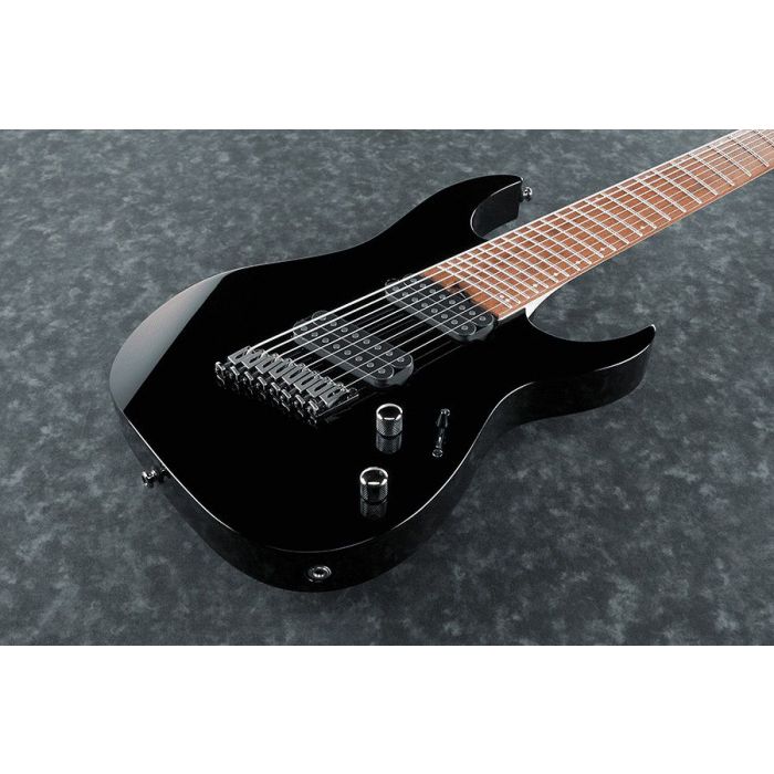 Closeup of the body on an Ibanez RGMS8-BK RG Iron Label 8 String Multi-scale Guitar, Black