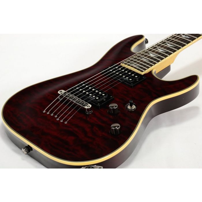 Schecter Omen Extreme-7 in Black Cherry Lying Down Angle