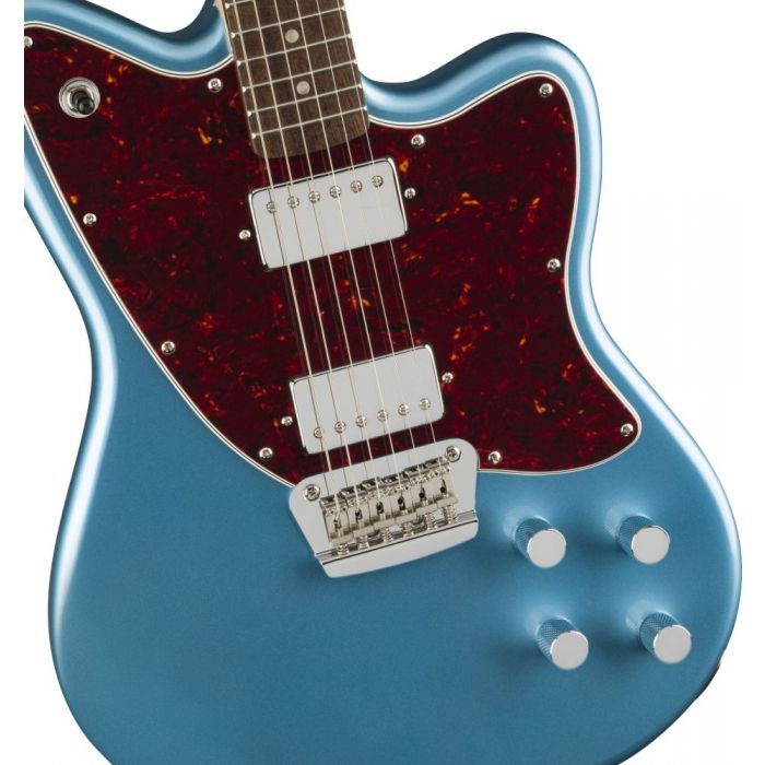 Closeup view of the body on a Squier Paranormal Toronado Guitar, Lake Placid Blue