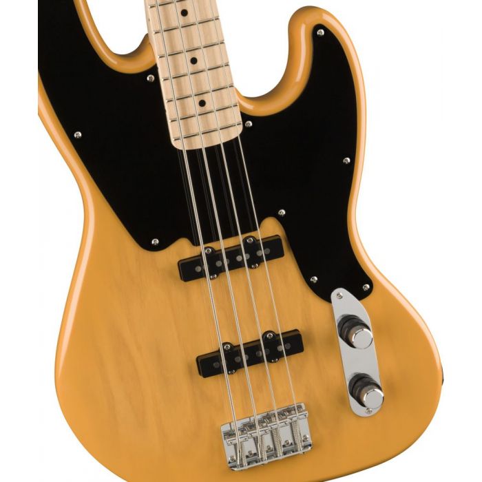 Closeup of the body on a Squier Paranormal Jazz Bass 54 MN, Butterscotch Blonde