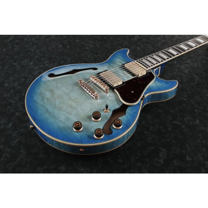 Closeup front view of an Ibanez AM93QM Semi Acoustic in Jet Blue Burst