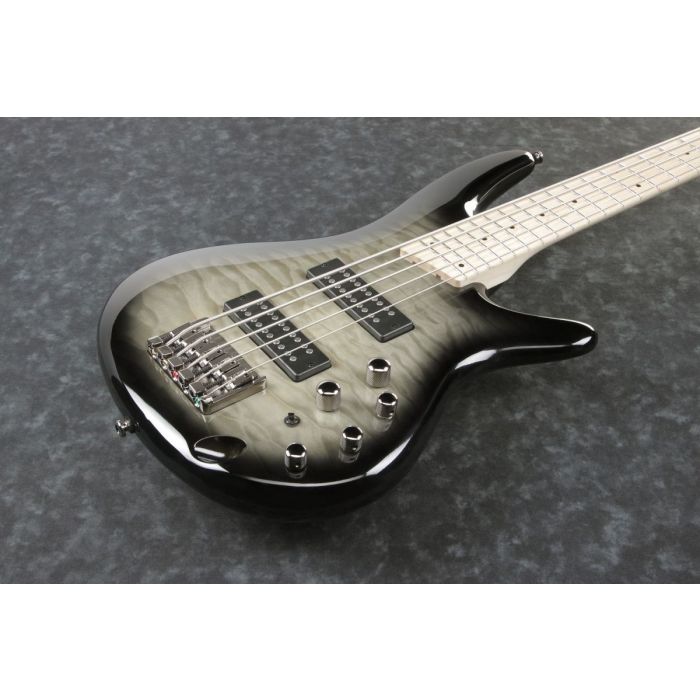 frontal closeup view of an Ibanez SR 5-string bass in Surreal Black Burst Gloss