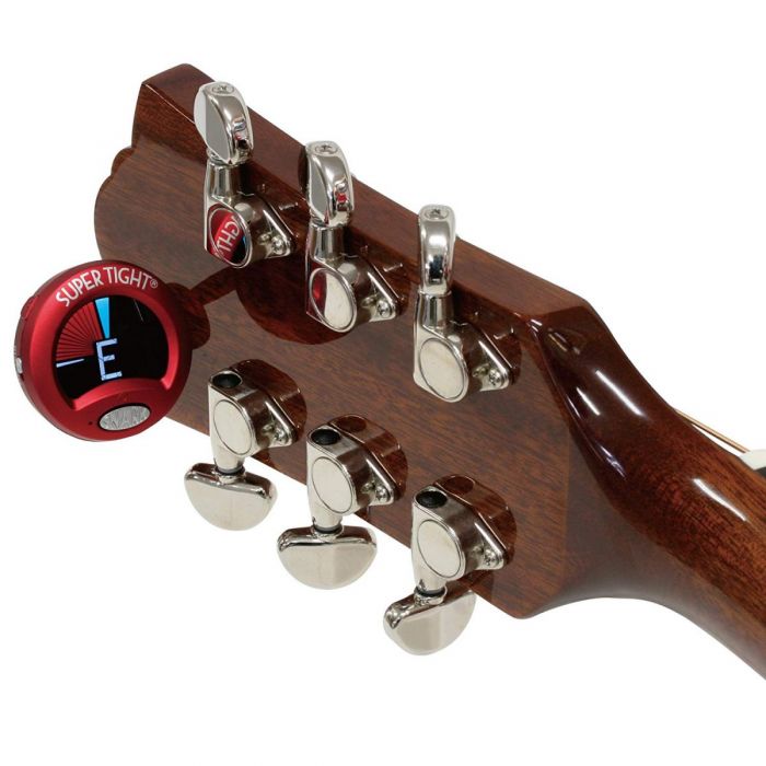 View of a Snark ST2 Chromatic Tuner clipped onto a guitar headstock
