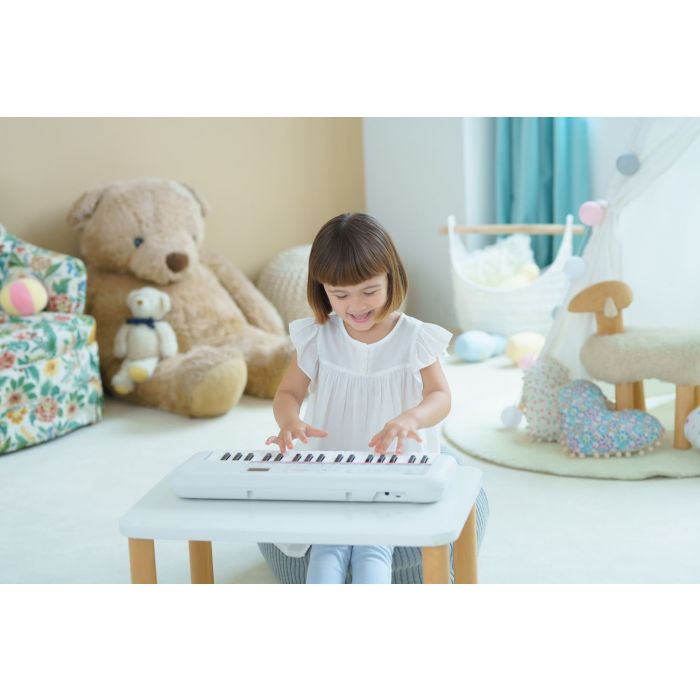 Child Playing the Yamaha Remie PSS-E30 Portable Keyboard