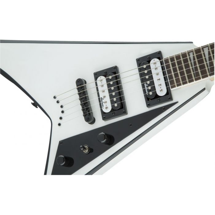 Closeup of the pickups on a Jackson JS32 guitar with a White and Black finish