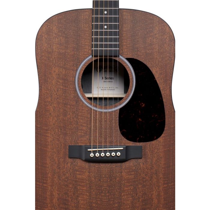 Closeup of the soundhole on a Martin D-X1E HPL Mahogany Electro Acoustic guitar
