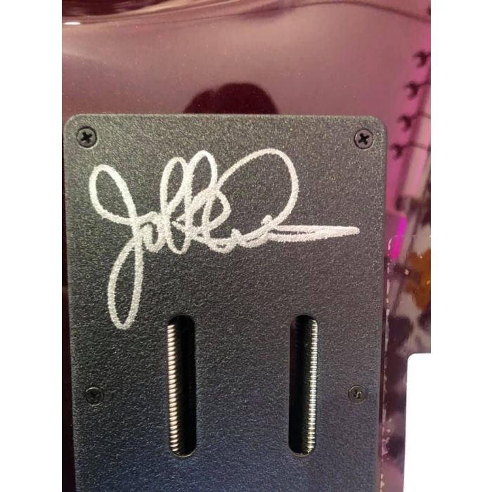 Closeup of the signed backplate on a Music Man BFR Majesty Electric Guitar in Jester Red