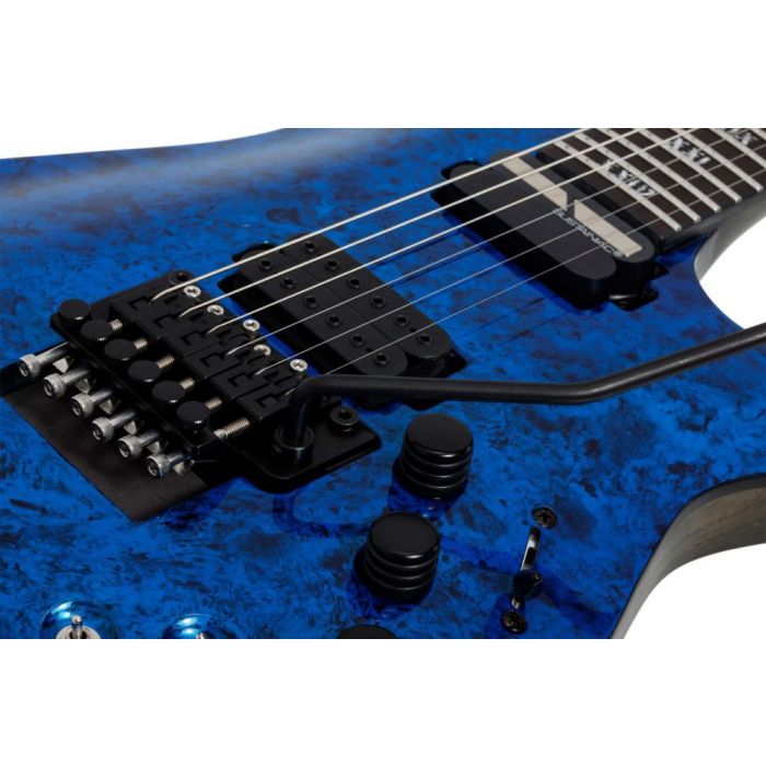 Closeup of the body on a Schecter C-1 FR S Apocalypse Blue Reign
