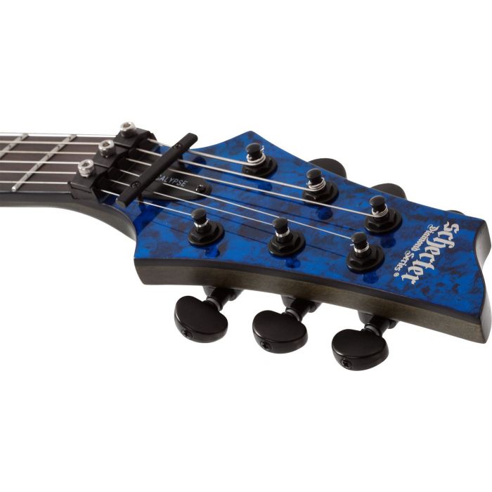 Closeup of the headstock on a Schecter C-1 FR S Apocalypse Blue Reign