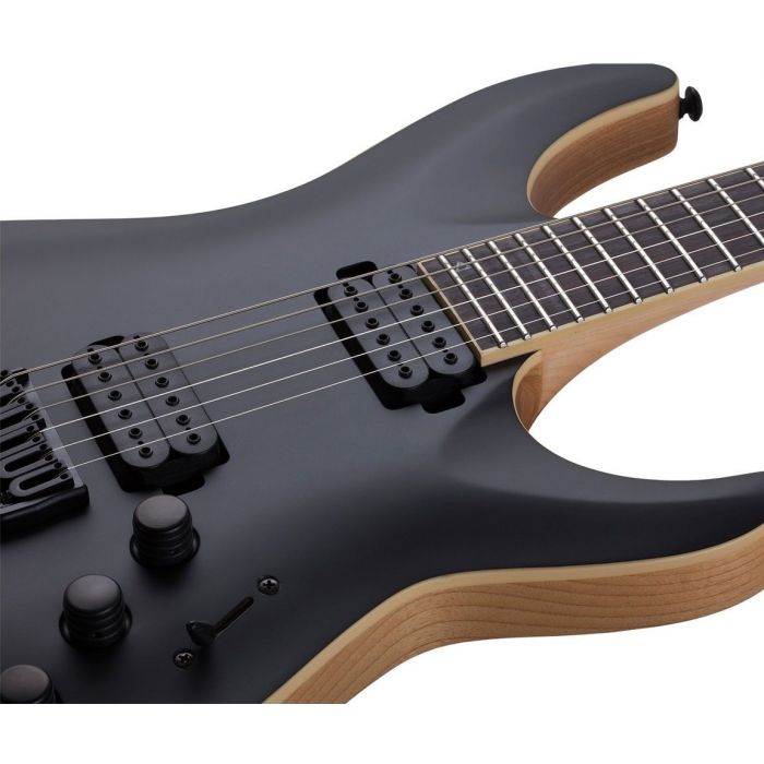 Closeup of the pickups on a Schecter C-1 Apocalypse Carbon Black Electric Guitar