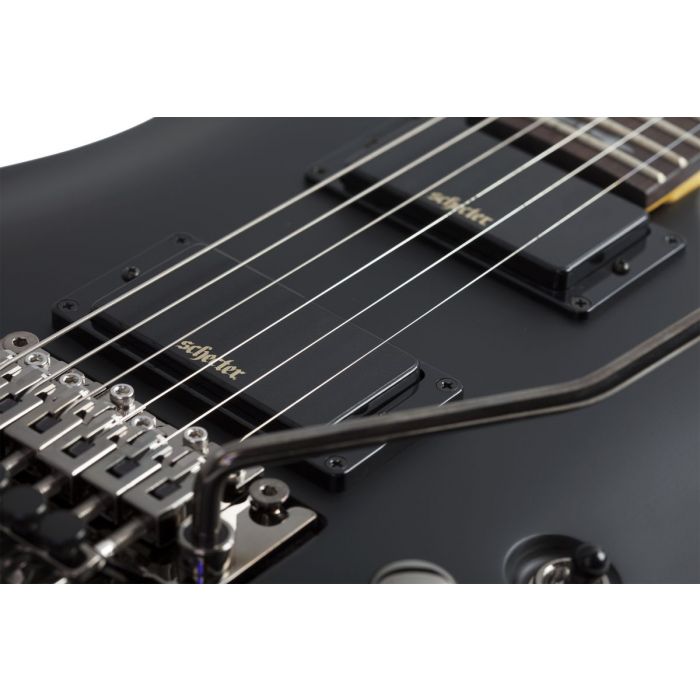 Closeup of the pickups on a Schecter Demon 6 FR Aged Black Satin Electric Guitar