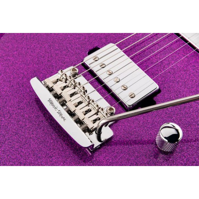 Closeup of the tremolo bridge on a Music Man Luke 3 HH Electric Guitar, Fuschia Sparkle