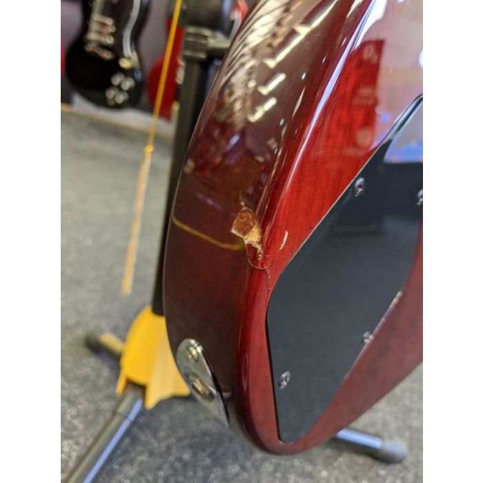 Closeup of the damage on a B Stock G&L Tribute ASAT Junior II Guitar, Trans Red