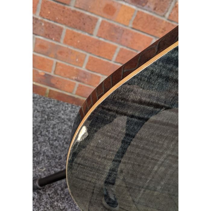 Closeup of the damage on a B-Stock PRS SE Tremonti Custom Grey Black Electric Guitar