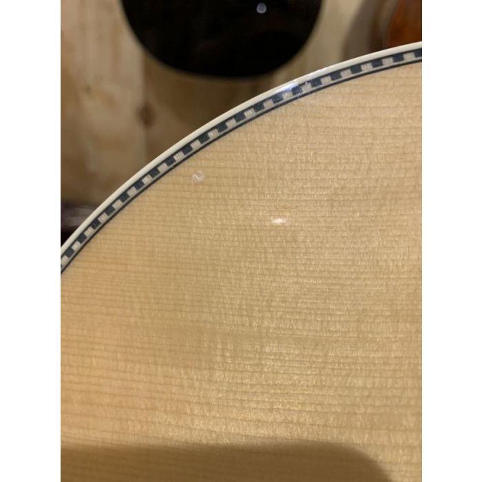 Closeup of the top damage on a B Stock Fender PM-1 Limited Adirondack Dreadnought