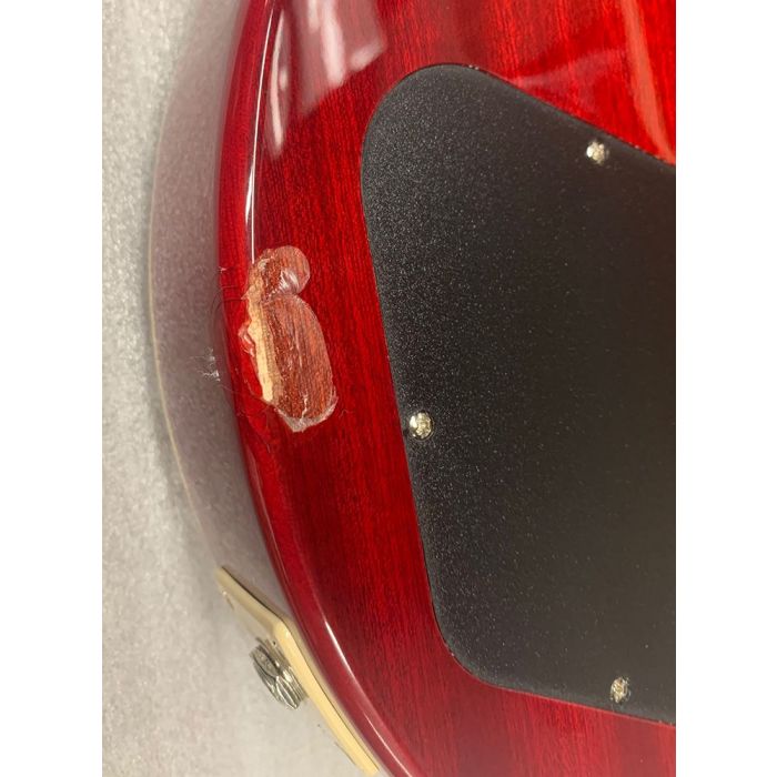 Closeup of the damage on a B-Stock Epiphone Les Paul Standard Plus-Top Pro, Blood Orange